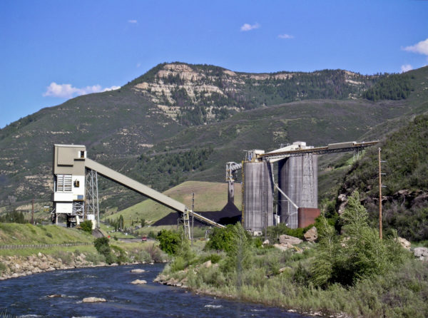 The North Fork of the Gunnison River flows past the stockpile and loadout facilities for Arch Coal's West Elk Mine in Gunnison County, Colorado. June 2004. Photo credit: Chris Carroll for the CGS.