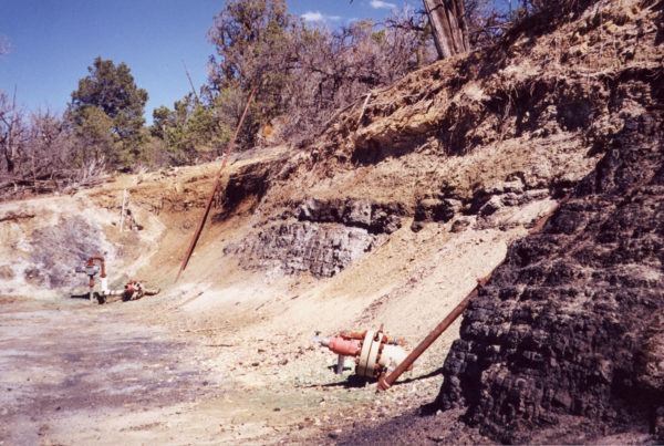 A Fruitland Formation outcrop with two CBM monitoring wells in the San Juan Basin, La Plata County, Colorado. The formation is a major coal-bearing rock unit. Photo credit: Colorado Geological Survey.