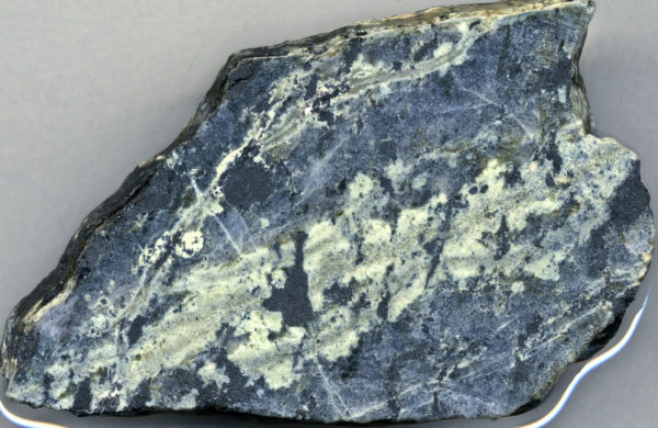 Uncompahgrite, a rare igneous rock from the Iron Hill (Powderhorn) Carbonatite Complex, in Gunnison County, Colorado. Photo credit: James St. John.