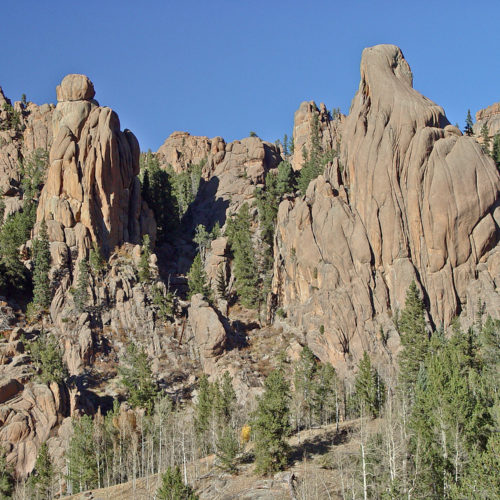 Weathered rocks of Colorado’s youngest Precambrian batholith—1.0-billion-year-old Pikes Peak Granite—form Cathedral Park along Gold Camp Road. Photo credit: Vince Matthews for the CGS.