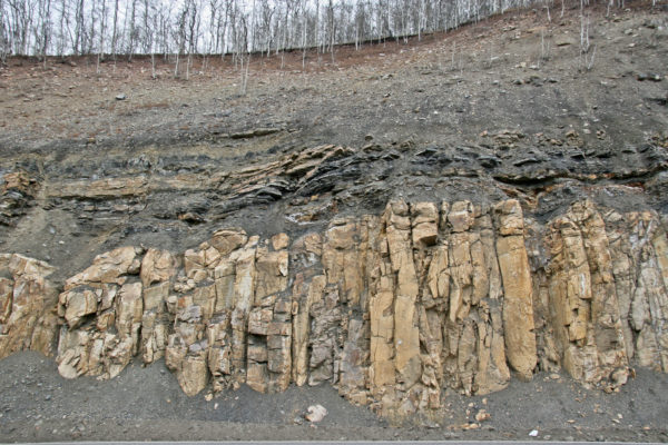 Early Paleogene (~68 mya) Pando porphyry sill intruding parallel to Carboniferous age sandstones and shales of the Minturn Formation, Eagle County, Colorado. Photo credit: Vince Matthews for the CGS.