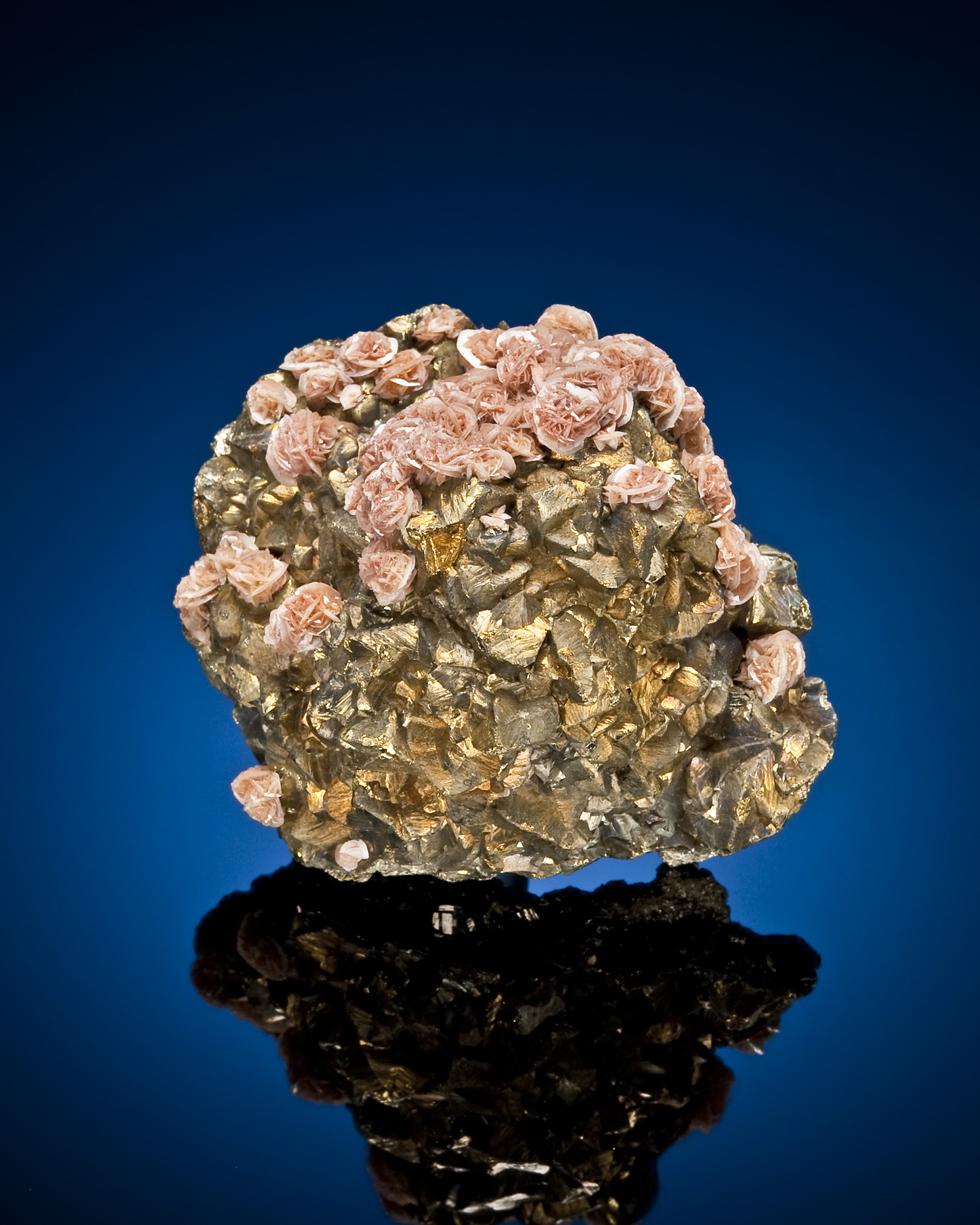 Siderite/rhodochrosite(?), chalcopyrite on pyrite; 5.7 cm tall. Eagle Mine, Gilman, Colorado. National Mining Hall of Fame Museum collection. Photo credit: Mark Mauthner.
