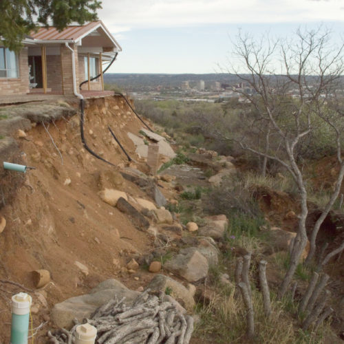 Dramatic landslide headscarp threatens this structure on Constellation Drive in Skyway, Colorado Springs, Colorado, May 2017. Photo credit: Jon Lovekin, PG for the CGS.