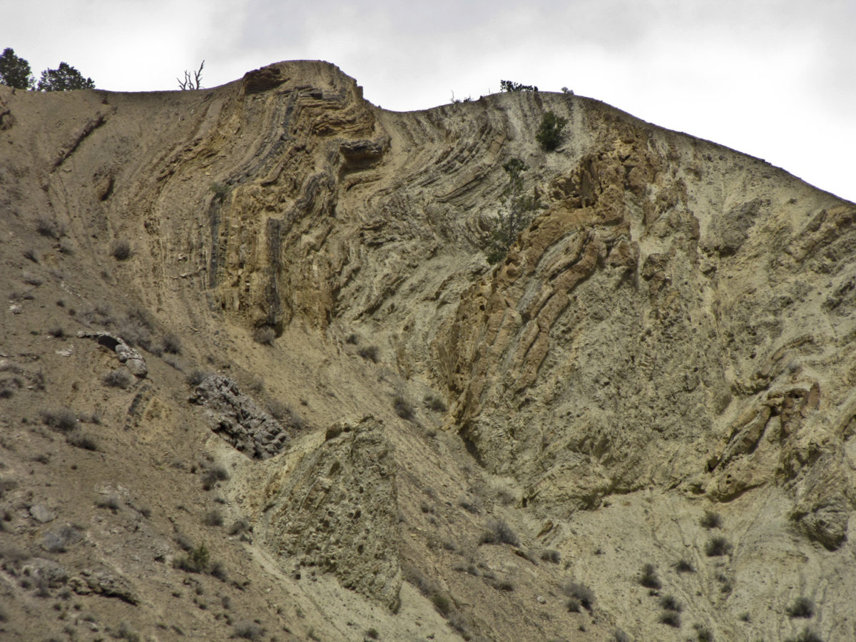 Figure 03. Highly contorted sedimentary strata in the evaporitic terrain between Gypsum and Glenwood Springs, Colorado, seen along the I-70 corridor, April 2012. Photo credit: Jon White for the CGS.