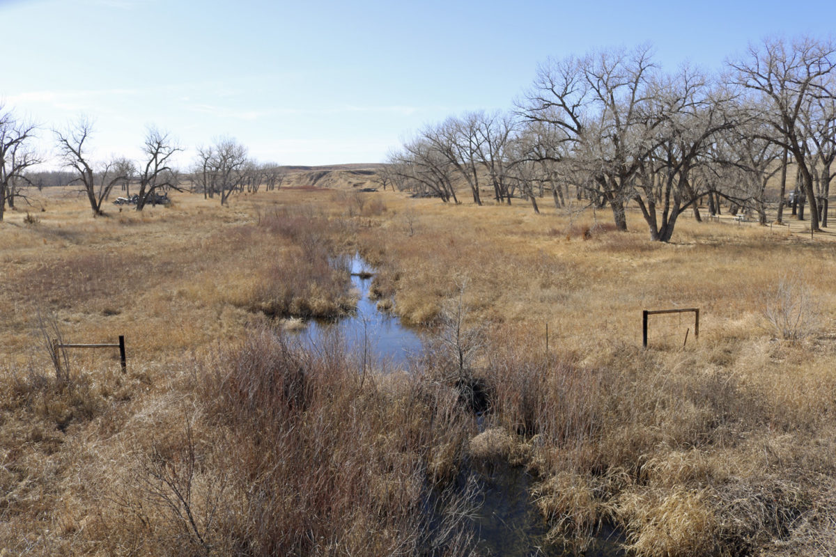 The Arikaree River at Beecher Island in Yuma County, Colorado, February 2017. The groundwater level is indicated by the pooling of water in the bed of the otherwise dry river channel. Water will fill low spots in the channel that are deep enough to reach the water table. Photo credit: Jeffrey Beall, Wikimedia Commons https://commons.wikimedia.org/.
