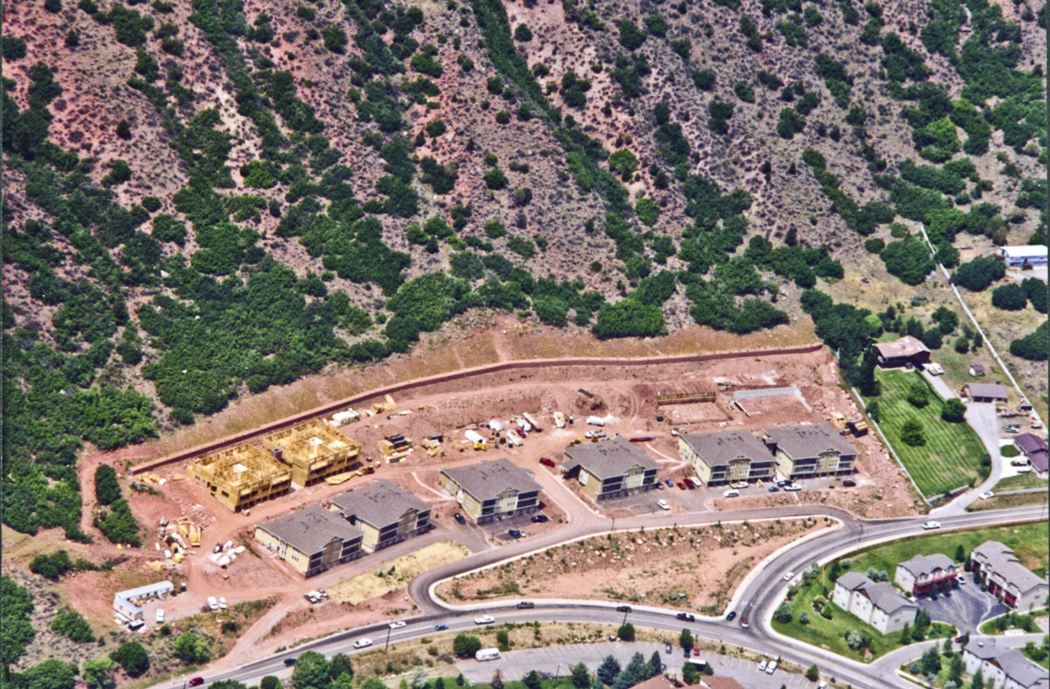 Figure 3 -- This development in west Glenwood Springs constructed a rockfall impact wall above their townhomes to protect against both rockfall and mudslides (debris flows). Photo credit: Jon White for the CGS.