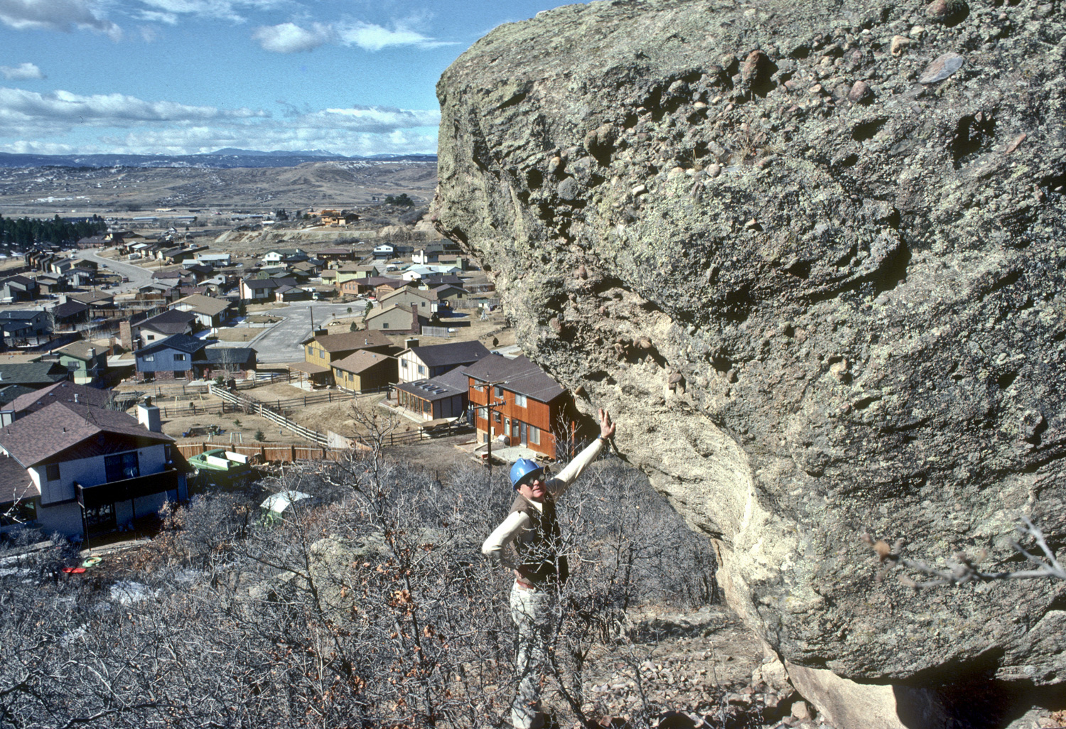 A close-up showing the scale of one of the blocks of Castle Rock Conglomerate that is already displaced, Castle Rock, Colorado, January 1981. Photo credit: Colorado Geological Survey.