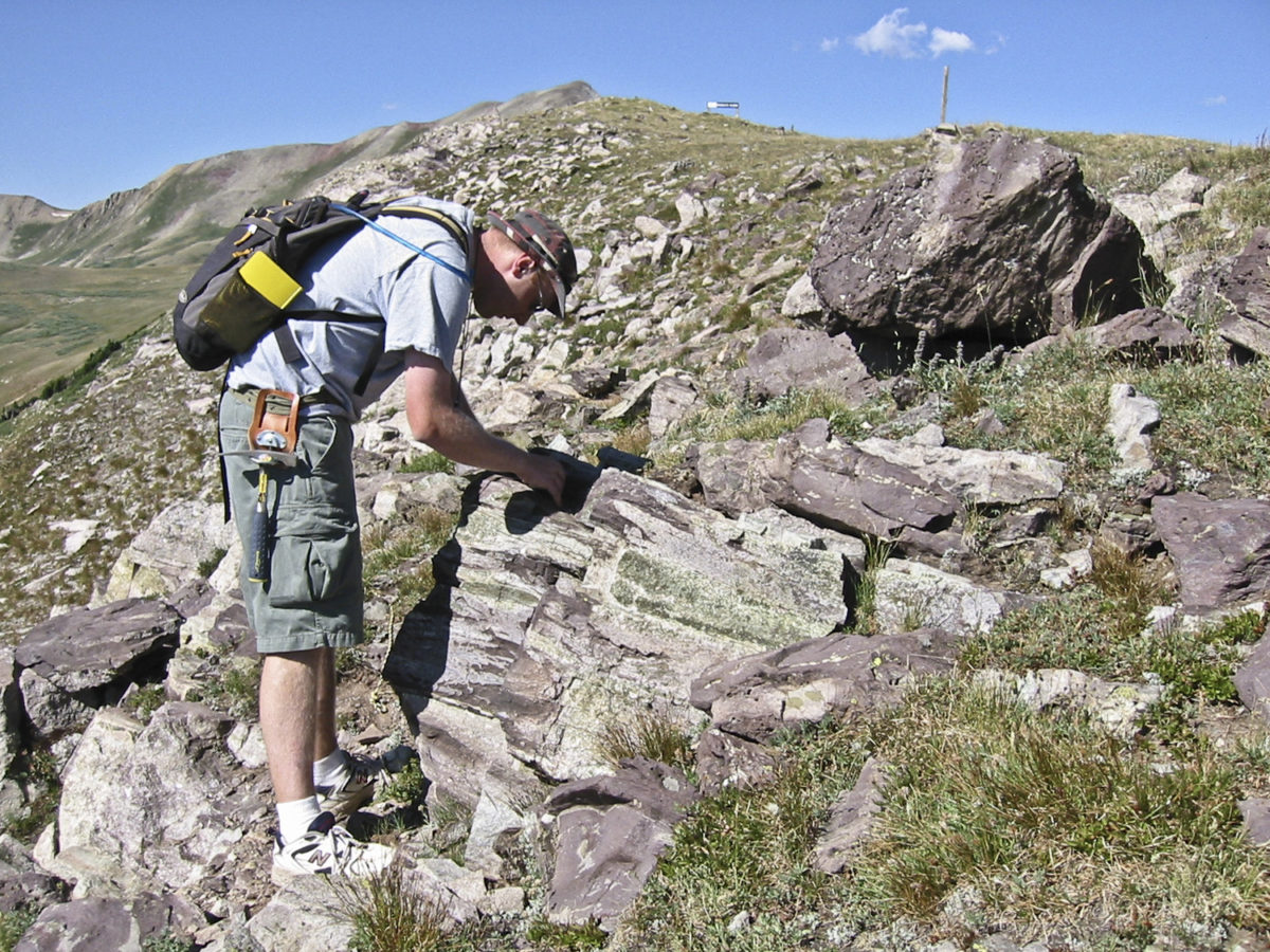 CGS field assistant maps hornfels near Copper Mountain, Colorado, July 2002. Photo credit: David Noe for the CGS.