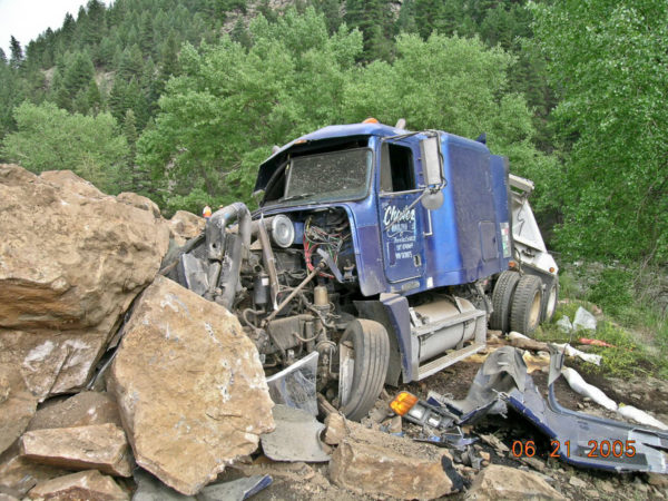 One of two semi trucks caught in the catastrophic rockfall in Clear Creek Canyon, about 10 miles west of Golden, Colorado. Photo credit: Colorado Geological Survey.