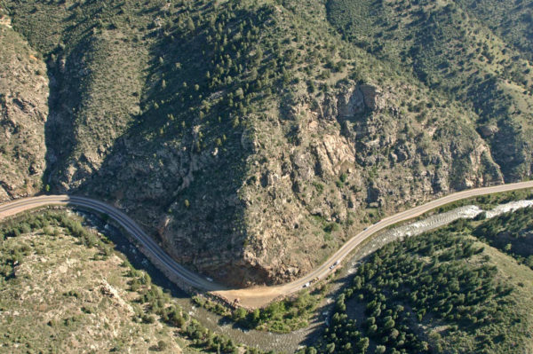 Aerial view of the rockslide site eight days after the event, the initial slide has been cleared from the road. Mitigation work would proceed for the next ten weeks until the road was reopened in September 2005. Photo credit: Colorado Geological Survey.