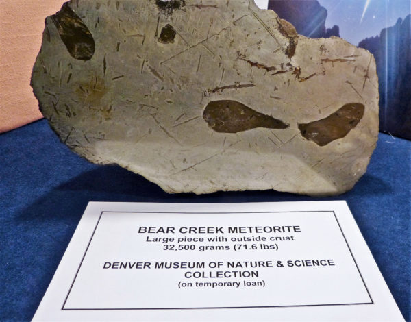 An 'end piece' of the Bear Creek meteorite with a polished face featuring a clear Widmanstätten pattern (aka Thomson structures), from the collection of the Denver Museum of Nature and Science (#5931). Photo credit: DMNS.