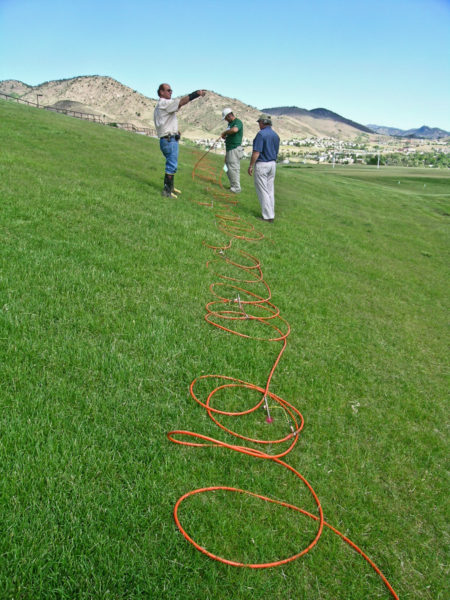 DC resistivity survey crew from the engineering firm Zapata/Blackhawk laying out the survey cables across the IM field area in 2008. Photo credit: T. C. Wait for the CGS.