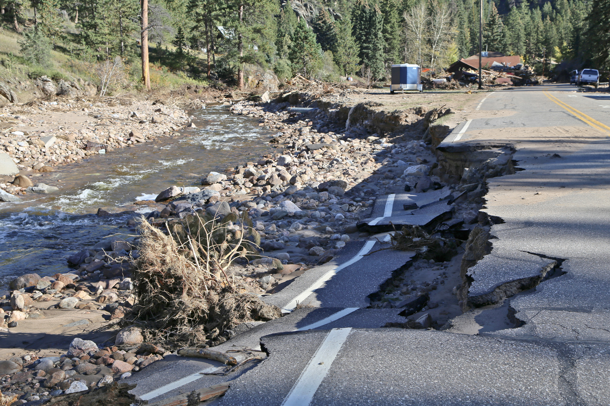 Road damage from bank erosion as a result of the September 2013 flood event in Boulder and Larimer counties. Photo credit: Jon White for the CGS.