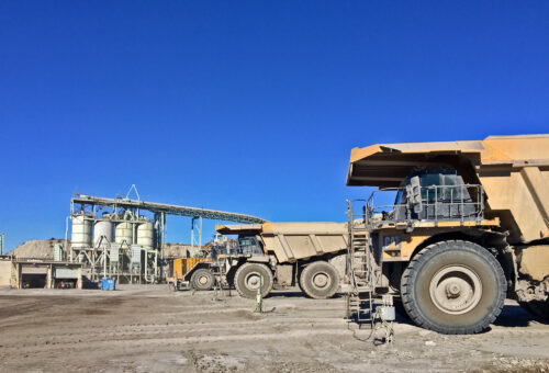 Large 700-series Caterpillar mine hauling trucks at the Holcim Portland Cement plant in Florence, Colorado. Photo credit: Larry Scott for the CGS.