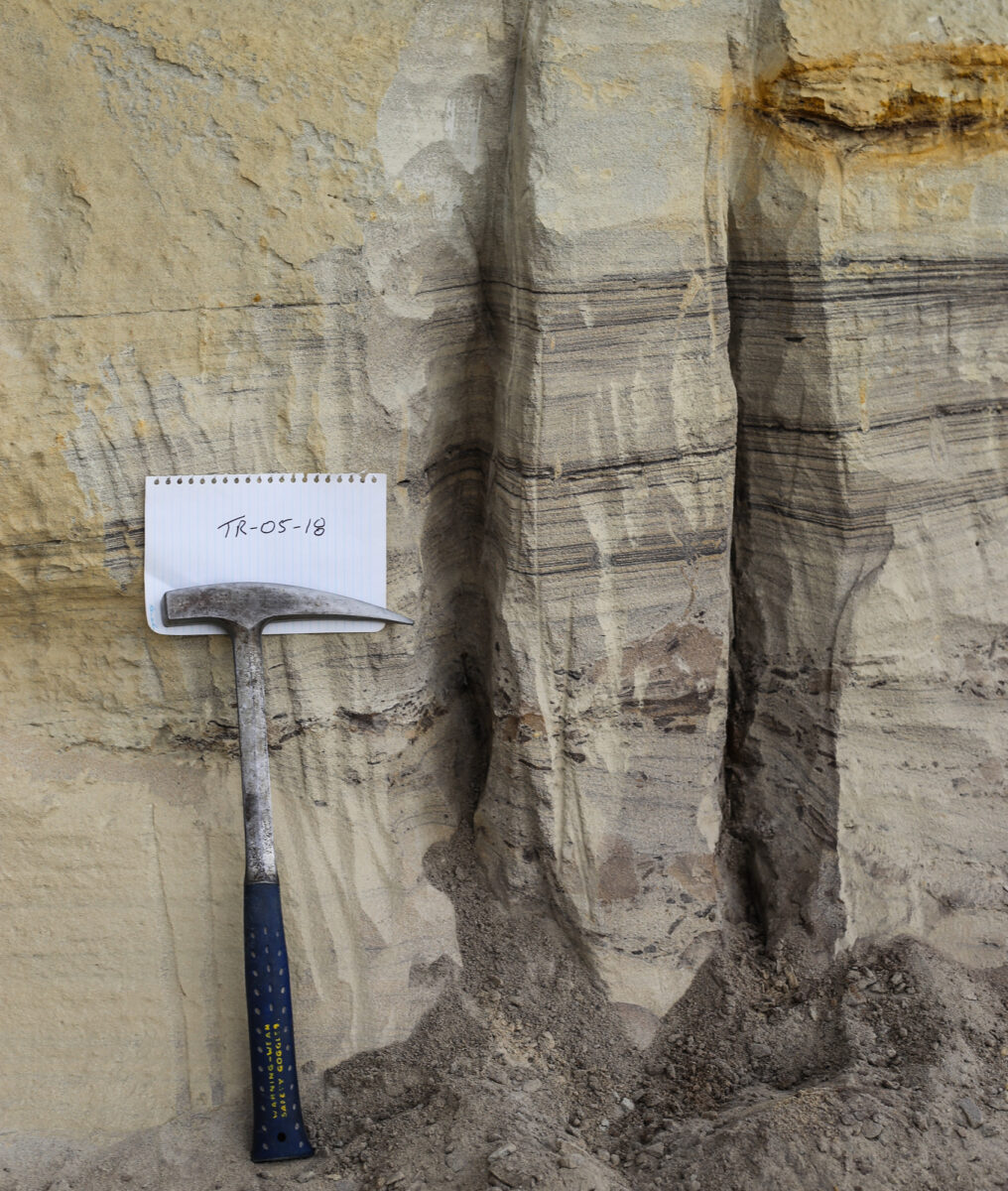 Sample site featuring heavy mineral laminae in beach placer deposits of the Fox Hills Sandstone at "Titanium Ridge" in Elbert County, Colorado. Photo credit: Michael O'Keeffe for the CGS.